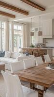 A large open living room with a dining table and chairs photo