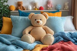 A teddy bear sits on a bed with colorful pillows photo