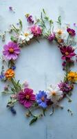A wreath of flowers is arranged on a blue background photo