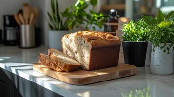A loaf of bread on a cutting board photo