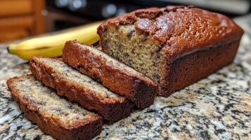 A loaf of banana bread with a banana on top photo