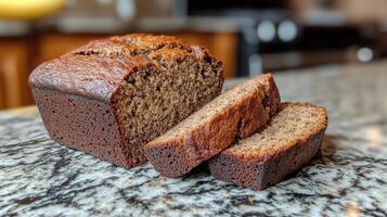 A loaf of banana bread sitting on a counter photo