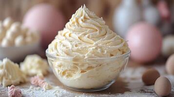 A bowl of whipped cream sits on a table photo