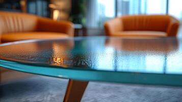 A glass table with a chair in front of it photo
