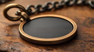 A black leather pendant on a chain photo