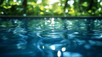 A pool with water and sunlight in the background photo