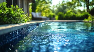 A pool with water and a green lawn photo