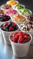 A row of cups with different toppings photo