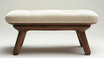 A stool with a beige cushion and wooden legs photo
