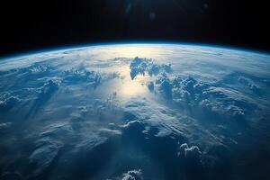 The earth from space with sun shining photo