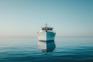 A boat floating in the ocean with a blue sky photo