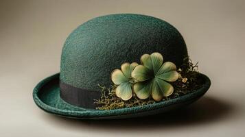 A green hat with four leaf clovers on it photo
