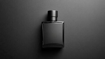 A black perfume bottle on a black background photo