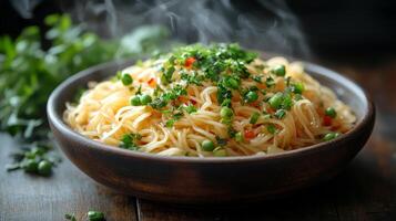 A bowl of noodles with green peas and herbs photo
