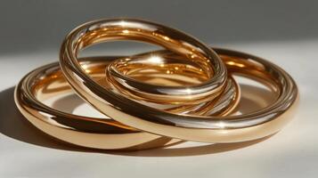 Three gold rings sitting on top of each other photo