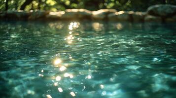 A pool with water and sunlight shining through it photo