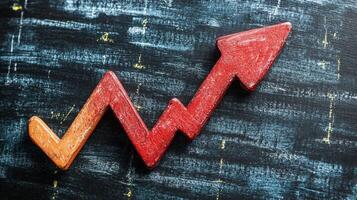 A red and orange arrow pointing upward on a black background photo