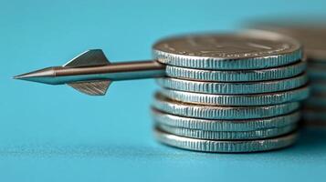 A stack of coins with a metal arrow sticking out of it photo
