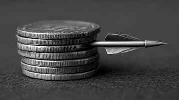 A stack of coins with a metal arrow sticking out of it photo