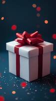 Gift box with red ribbon and christmas lights on blue background photo