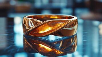 A gold ring with a yellow stone on top photo