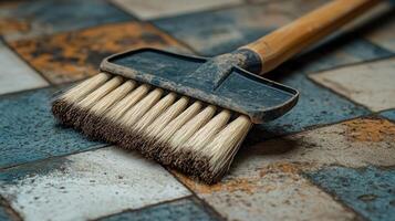 A brush on a tile floor photo