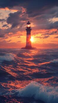 A lighthouse is in the middle of the ocean at sunset photo
