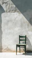 A chair sitting against a wall with a shadow photo