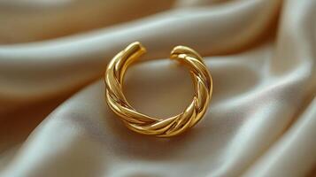 A gold ring with twisted rope on it photo