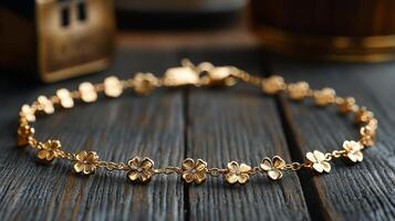 A gold bracelet with small flowers on it photo