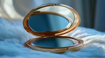 A compact mirror with a blue reflection photo