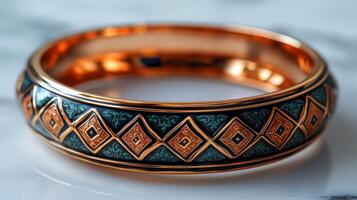 A ring with a geometric design in gold and green photo