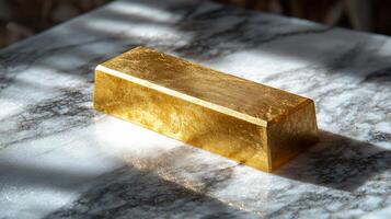 A gold bar sitting on top of a marble table photo