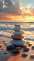 A stack of stones on the beach at sunset photo