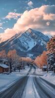 A snowy road in front of a mountain photo