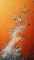 Water splash on orange background photo