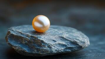 Beautiful pearl resting on a smooth stone in soft natural light photo