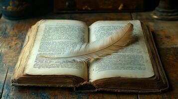 An open book with a feather on top photo