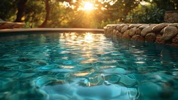 A pool with water and rocks in the sun photo