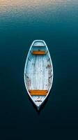 An empty boat floating in the water photo