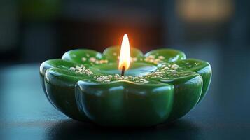 A green candle with a white flame photo