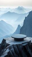 A circular table on top of a mountain overlooking the valley photo