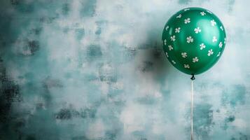 A green balloon with a shamrock design on it photo