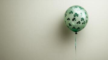 A green balloon with shamrocks on it photo