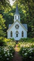 A white church surrounded by flowers in the woods photo