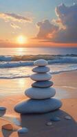 A stack of stones on the beach at sunset photo