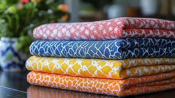 A stack of colorful towels on a table photo
