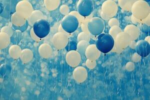 Blue and white balloons floating in the air photo