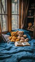 Two teddy bears sit on a bed with a book photo