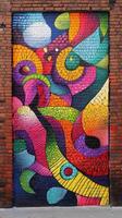 A colorful mural on a brick wall photo